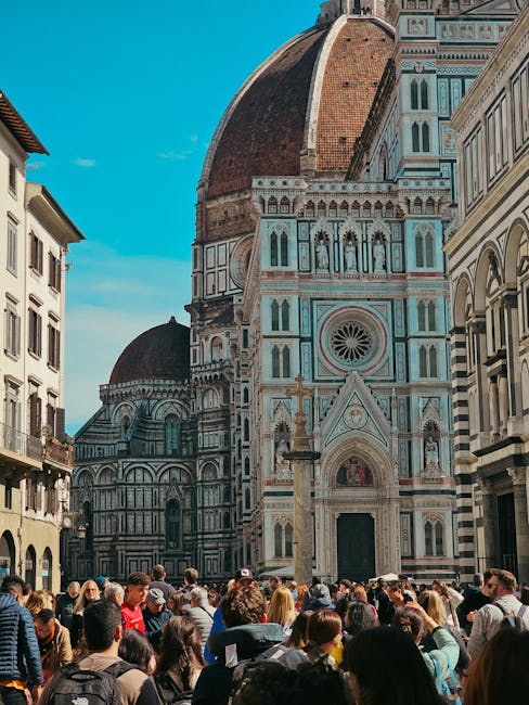 Experience the vibrant atmosphere at Florence's famous cathedral with a bustling crowd.